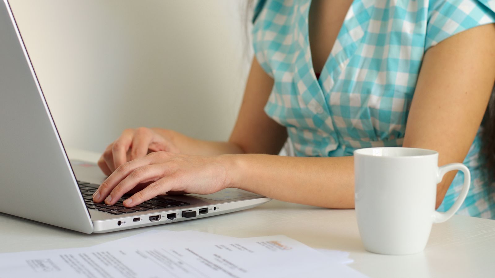 Woman working on a laptop at desk
