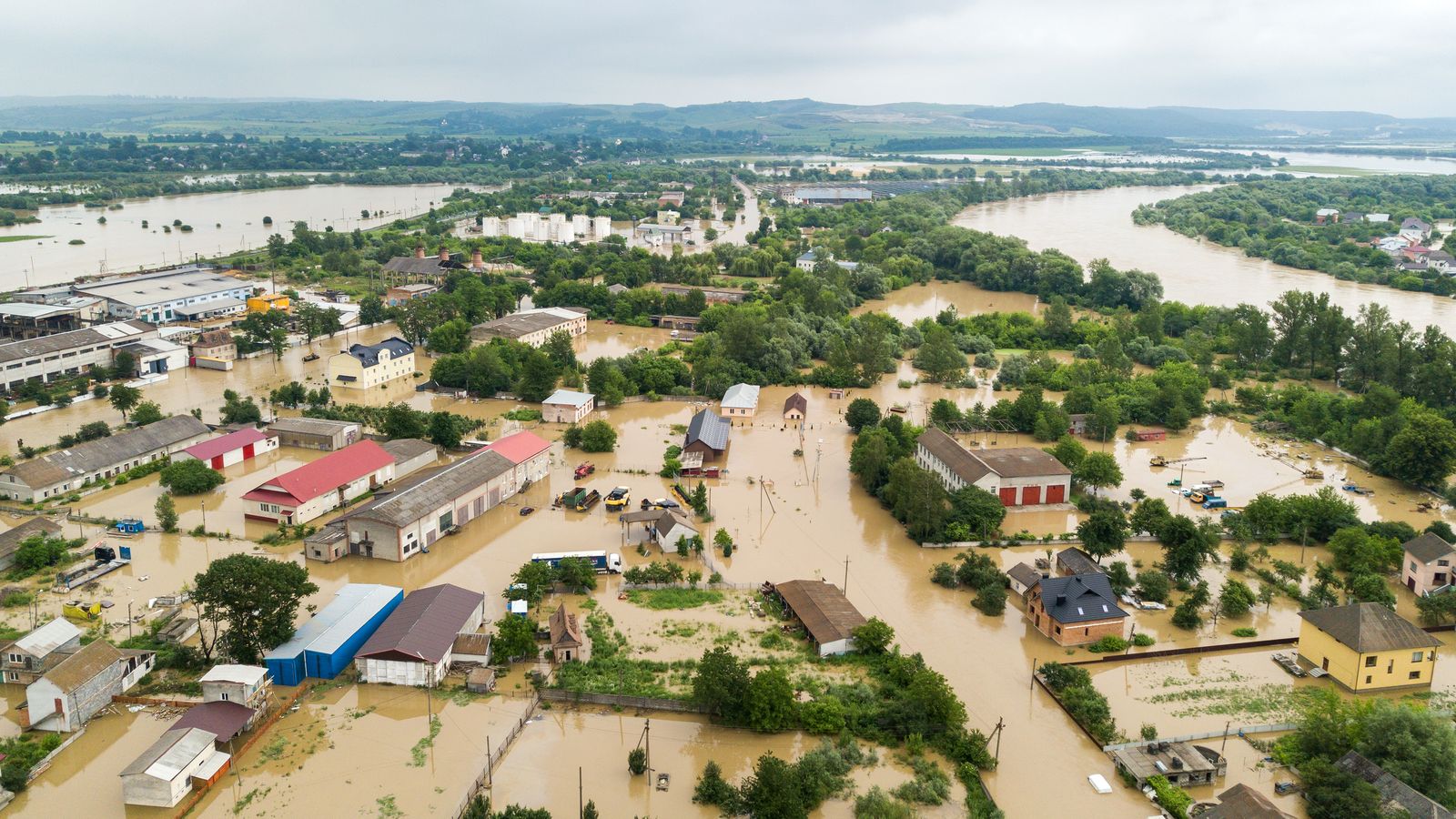 Aerial view of flooded houses in a riverside town